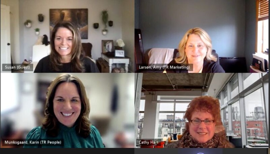 four individuals on an MS teams call all smiling looking into the camera 