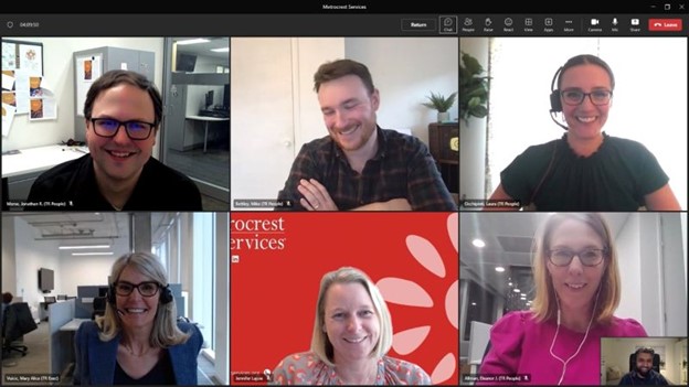 seven individuals on an Microsoft teams call all smiling looking into the camera 